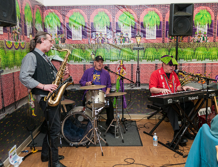 Pete Gumbo& The Storyville Ramblers - Bobby Michaels, sax - Bob Holden, drums, vocals - Pete Gumbo, piano, vocals - kept the crowd hopping at the Mardi Gras party on Feb. 17, at the Roseland Public Library.